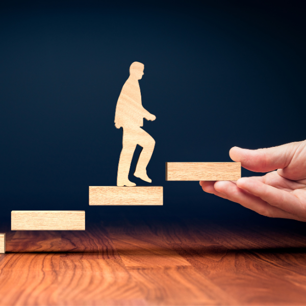 alt="person stepping into a ladder"